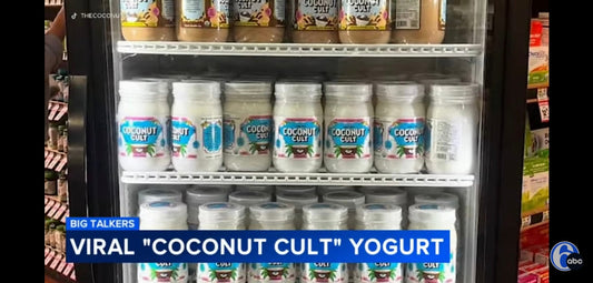 A screenshot from ABC6 News of Coconut Cult Original and Chocolate Mousse jars on the shelves of a fridge in a grocery store with the headline "Big Talkers - Viral "Coconut Cult" Yogurt"
